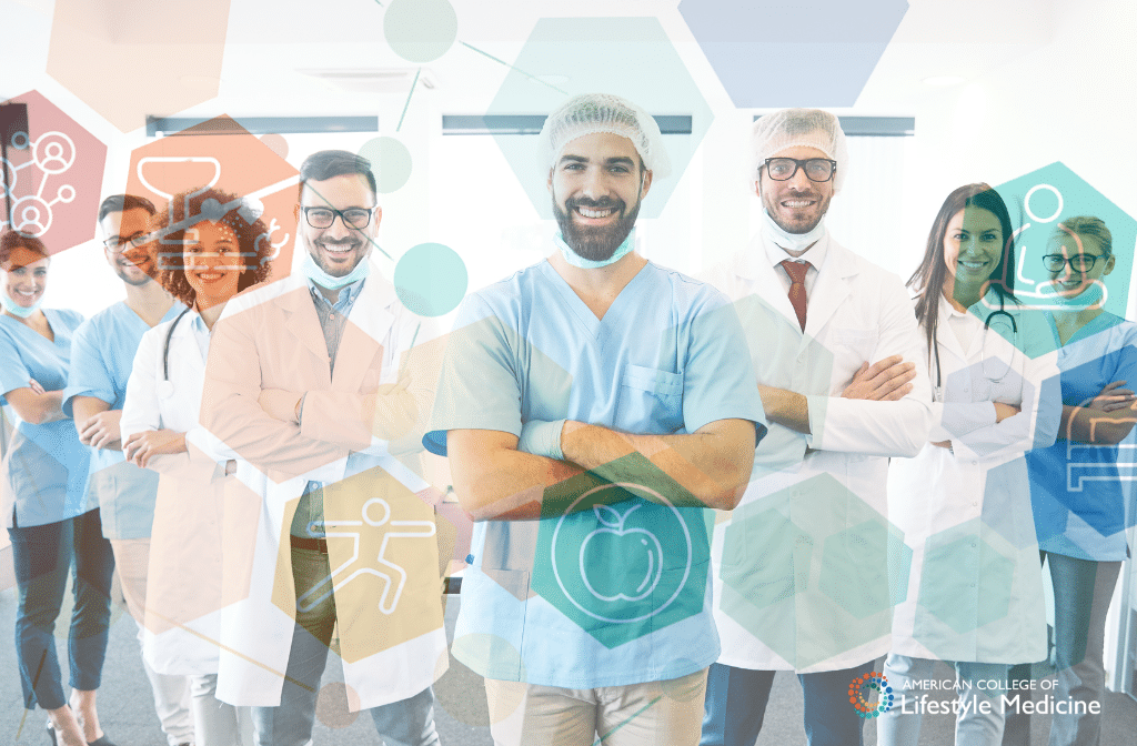 A group of healthcare professionals standing in a line with their arms crossed smiling. There is a mixture of genders and race represented in the image.